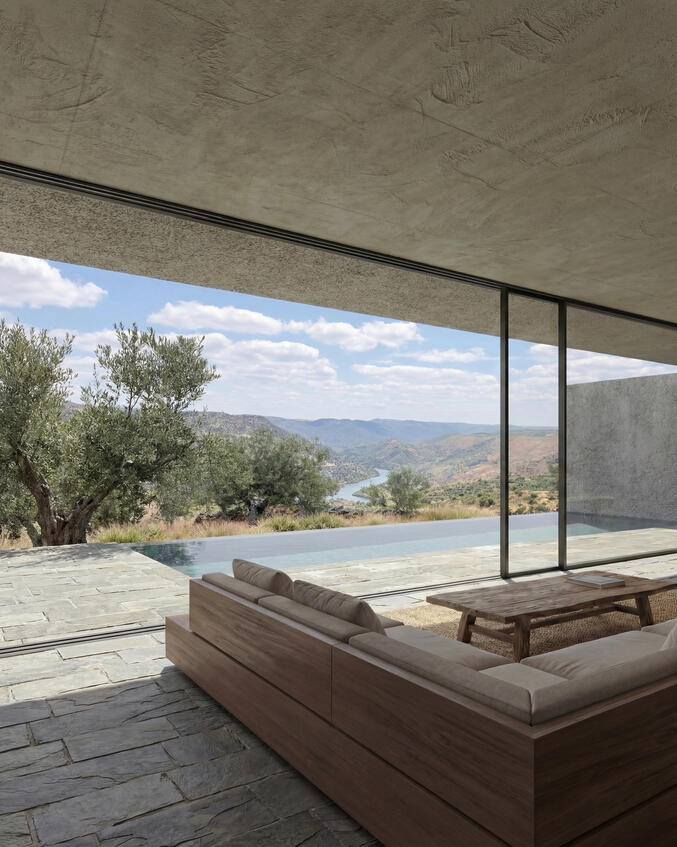Mazouco House View of the living room inside, over the landscape and the river outside, through the big ground to ceiling windows.